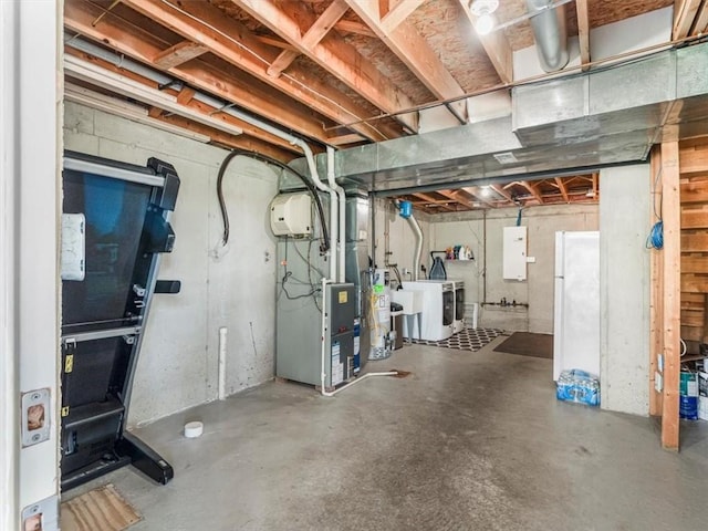 2707 Country Club Dr, Robinson Twp, PA 15205 - unfinished below grade area featuring heating unit, separate washer and dryer, and freestanding refrigerator
