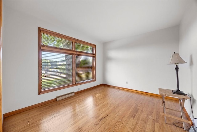 367 Crescent Dr, Canton Twp, PA 15301 - empty room with wood finished floors and a baseboard radiator