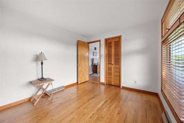 367 Crescent Dr, Canton Twp, PA 15301 - empty room with light wood-style flooring and a baseboard heating unit