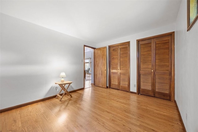 367 Crescent Dr, Canton Twp, PA 15301 - unfurnished bedroom with two closets and light wood-type flooring