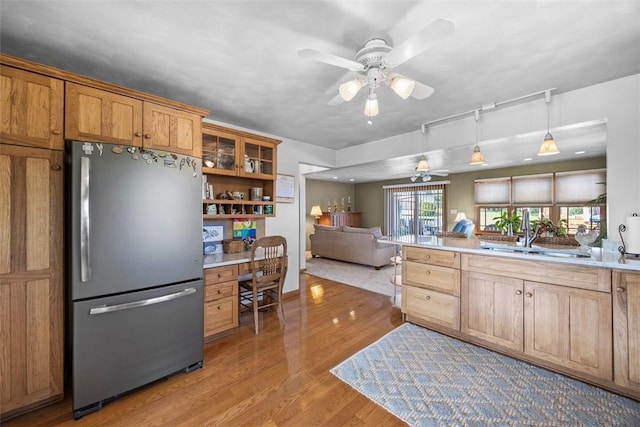 367 Crescent Dr, Canton Twp, PA 15301 - kitchen featuring freestanding refrigerator, built in desk, a ceiling fan, light wood-type flooring, and open floor plan