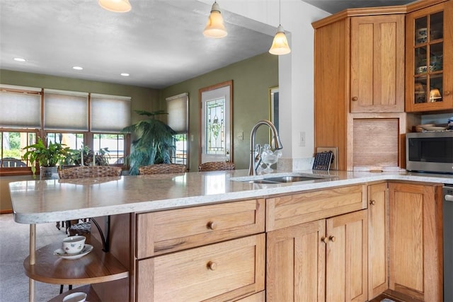 367 Crescent Dr, Canton Twp, PA 15301 - kitchen featuring appliances with stainless steel finishes, a peninsula, light stone counters, glass insert cabinets, and open shelves