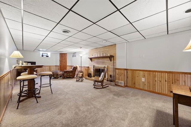 367 Crescent Dr, Canton Twp, PA 15301 - carpeted living area featuring wainscoting, wood walls, and a drop ceiling