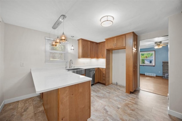 3960 Millers Run Rd, Cecil, PA 15057 - kitchen featuring a peninsula, light countertops, dishwasher, brown cabinets, and ceiling fan