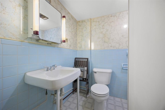 3960 Millers Run Rd, Cecil, PA 15057 - bathroom featuring a wainscoted wall, wallpapered walls, tile walls, and tile patterned floors