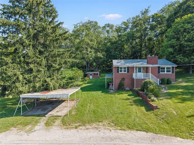 3960 Millers Run Rd, Cecil, PA 15057 - view of green lawn featuring a carport, driveway, a porch, and a forest view