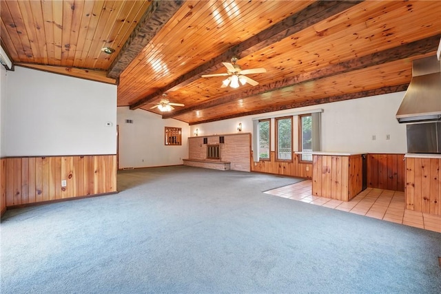 14 Denamen B Dr, West Middlesex Boro, PA 16159 - unfurnished living room featuring light carpet, ceiling fan, wooden walls, a wainscoted wall, and wood ceiling