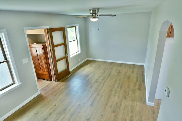 49 N Oakdale Ave, Hermitage, PA 16148 - spare room with ceiling fan, wood finished floors, and arched walkways