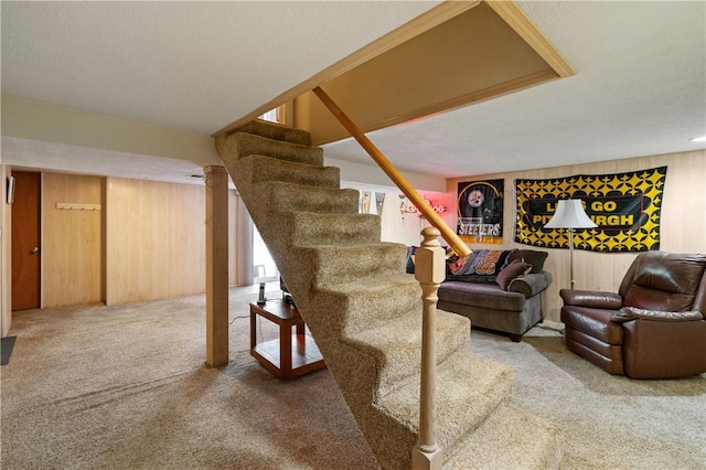 2534 Jefferson Ave, West Mifflin, PA 15122 - carpeted living area with stairs and wooden walls