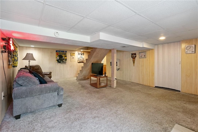 2534 Jefferson Ave, West Mifflin, PA 15122 - carpeted living area featuring a paneled ceiling, stairway, and wood walls
