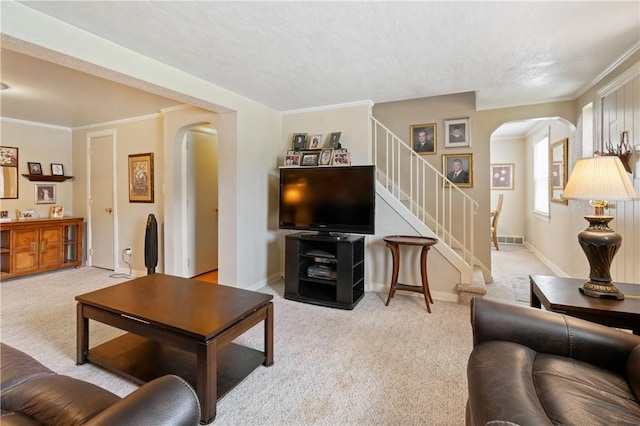 2534 Jefferson Ave, West Mifflin, PA 15122 - carpeted living area featuring arched walkways, stairway, a textured ceiling, and crown molding