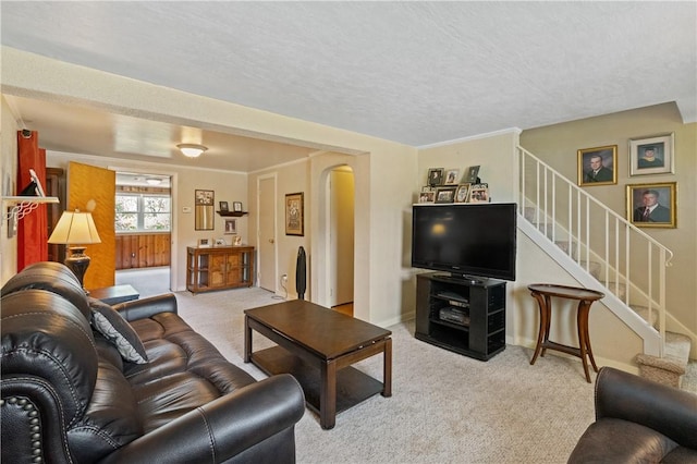 2534 Jefferson Ave, West Mifflin, PA 15122 - carpeted living room featuring arched walkways, stairs, and a textured ceiling