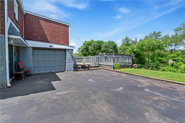 2534 Jefferson Ave, West Mifflin, PA 15122 - view of vehicle parking with a garage and asphalt driveway