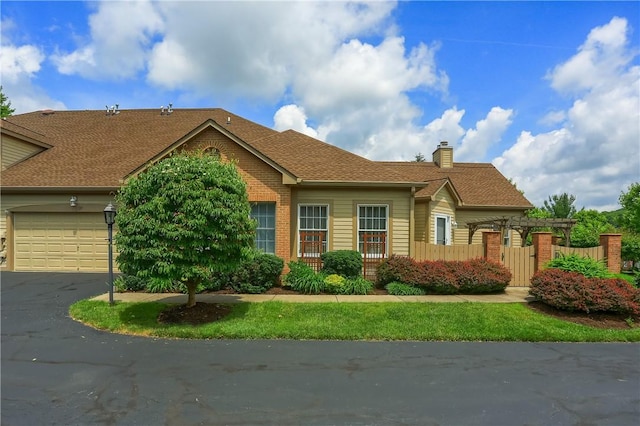 135 Linden Ct, Seven Fields Boro, PA 16046 - view of front facade featuring an attached garage, driveway, a chimney, and brick siding