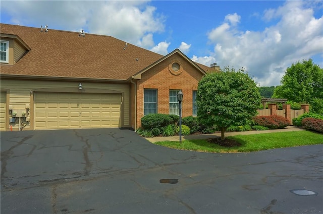 135 Linden Ct, Seven Fields Boro, PA 16046 - view of front of property with asphalt driveway, brick siding, a garage, and a shingled roof
