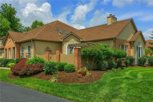 135 Linden Ct, Seven Fields Boro, PA 16046 - view of front of home with brick siding, a chimney, and roof with shingles