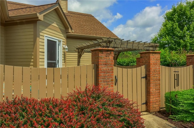 135 Linden Ct, Seven Fields Boro, PA 16046 - view of side of property featuring a shingled roof, a gate, a chimney, and a pergola