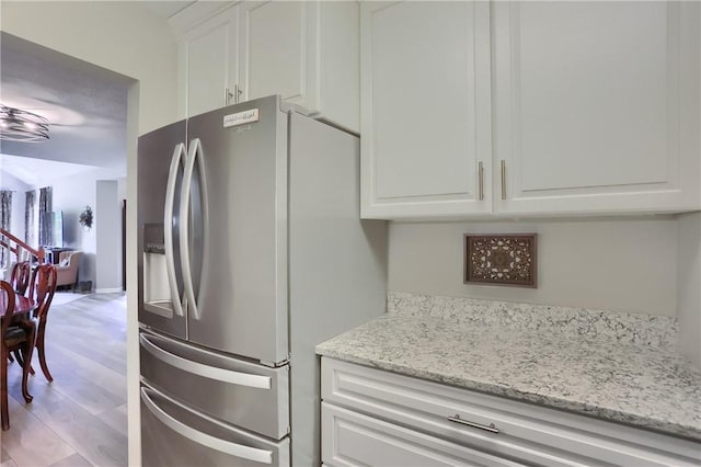 135 Linden Ct, Seven Fields Boro, PA 16046 - kitchen featuring stainless steel refrigerator with ice dispenser, white cabinetry, light stone countertops, and light wood-style floors