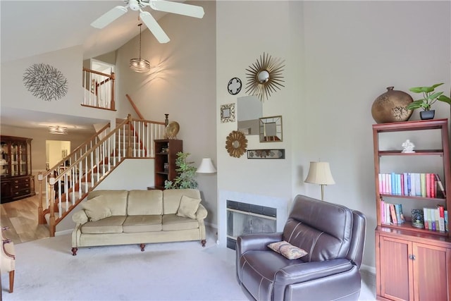 135 Linden Ct, Seven Fields Boro, PA 16046 - carpeted living room with stairs, ceiling fan, and high vaulted ceiling