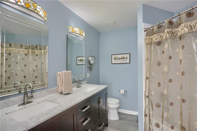 135 Linden Ct, Seven Fields Boro, PA 16046 - full bath with a shower with curtain, double vanity, and wood finished floors