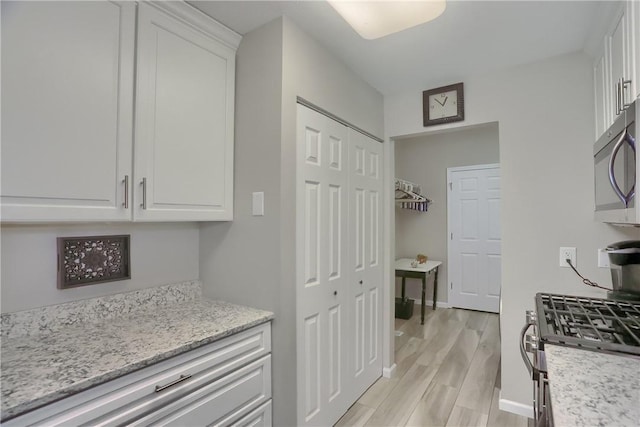 135 Linden Ct, Seven Fields Boro, PA 16046 - kitchen featuring appliances with stainless steel finishes, white cabinetry, and light wood finished floors