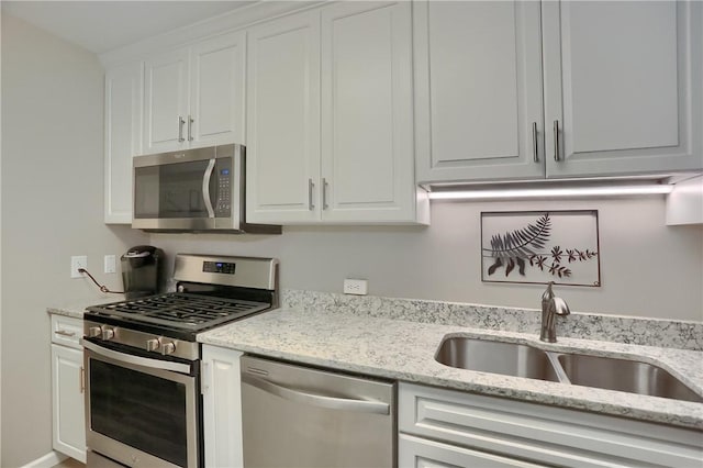 135 Linden Ct, Seven Fields Boro, PA 16046 - kitchen featuring appliances with stainless steel finishes, white cabinets, and light stone countertops