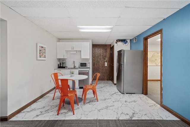 200 Commerce Dr Unit 210, Moon/Crescent Twp, PA 15108 - dining area with light marble finish flooring and a paneled ceiling