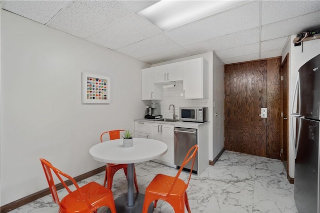 200 Commerce Dr Unit 210, Moon/Crescent Twp, PA 15108 - kitchen with light marble finish flooring, stainless steel appliances, a drop ceiling, white cabinets, and light countertops