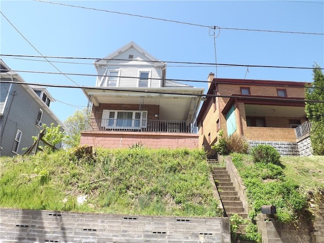 71 Watkins Ave, Donora, PA 15033 - view of front facade featuring stairs and brick siding