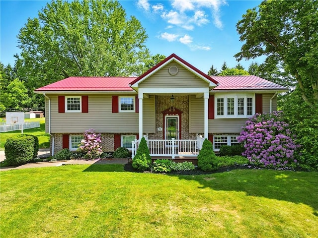 236 Fredonia Rd, Hempfield Twp Mer, PA 16125 - raised ranch with a front yard, a metal roof, a porch, and brick siding