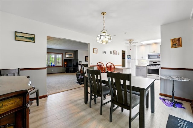 236 Fredonia Rd, Hempfield Twp Mer, PA 16125 - dining room with light wood-style floors and ceiling fan