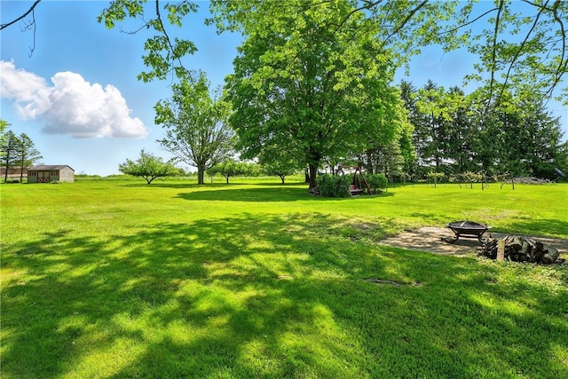 236 Fredonia Rd, Hempfield Twp Mer, PA 16125 - view of grassy yard with an outdoor fire pit