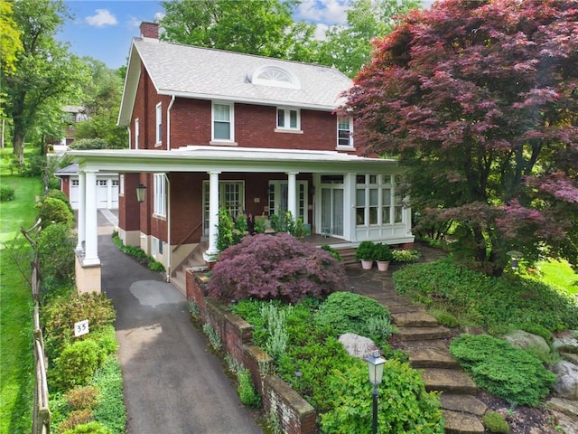 35 Pleasant Valley Rd, Hempfield Twp Wml, PA 15644 - view of front of property with a chimney, covered porch, and brick siding