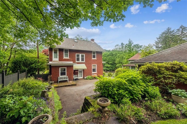 35 Pleasant Valley Rd, Hempfield Twp Wml, PA 15644 - rear view of property with brick siding and driveway