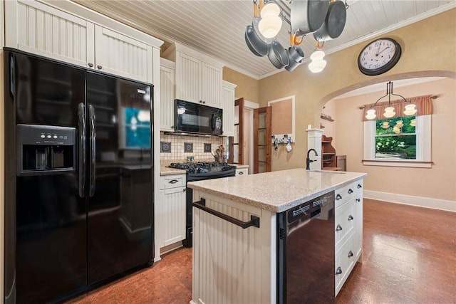 35 Pleasant Valley Rd, Hempfield Twp Wml, PA 15644 - kitchen featuring black appliances, a chandelier, arched walkways, backsplash, and light stone counters