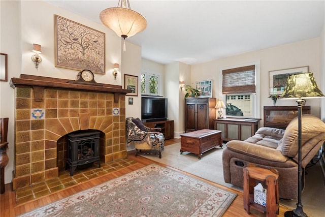35 Pleasant Valley Rd, Hempfield Twp Wml, PA 15644 - living area with a wood stove and wood finished floors