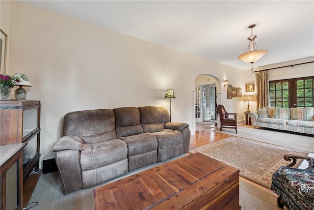 35 Pleasant Valley Rd, Hempfield Twp Wml, PA 15644 - living room with arched walkways, wood finished floors, and french doors