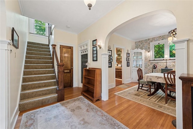 35 Pleasant Valley Rd, Hempfield Twp Wml, PA 15644 - foyer entrance featuring arched walkways, light wood-style floors, stairs, and crown molding
