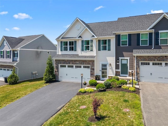 134 Black Oak Ln, Cecil, PA 15057 - view of property with asphalt driveway, a garage, a front lawn, and stone siding