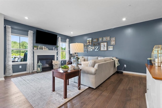 134 Black Oak Ln, Cecil, PA 15057 - living room featuring dark wood finished floors, a fireplace with flush hearth, and recessed lighting