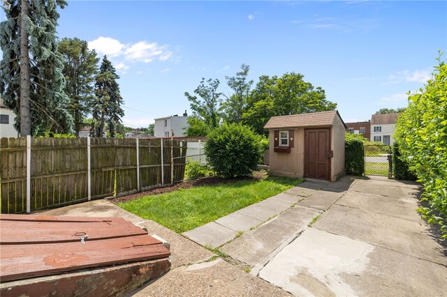 116 Walter, Allentown, PA 15210 - fenced backyard with a storage unit and a patio