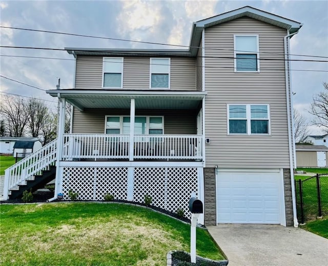 39 Delmont Ave, Delmont, PA 15626 - view of front of property with covered porch, stairs, a garage, concrete driveway, and stone siding