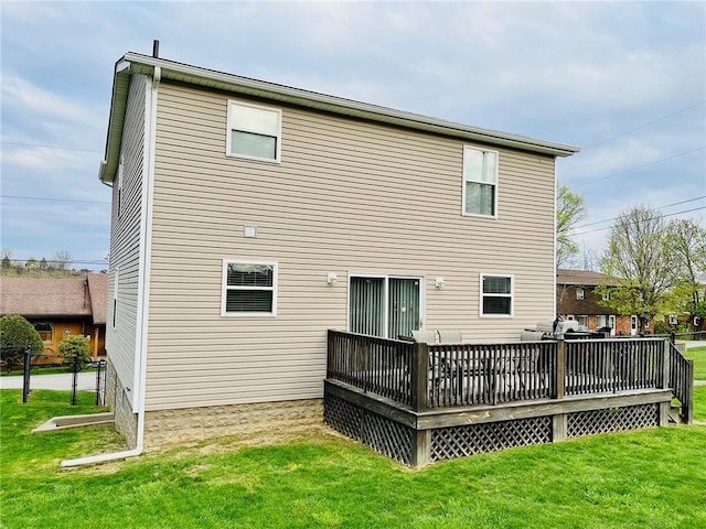 39 Delmont Ave, Delmont, PA 15626 - back of property featuring a lawn and a wooden deck