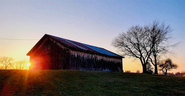 39 Delmont Ave, Delmont, PA 15626 - outdoor structure at dusk with a yard
