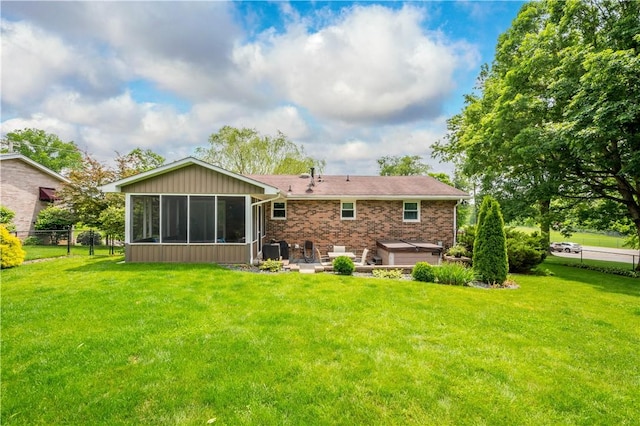 1116 Mcgovern Rd, Chartiers, PA 15342 - rear view of property featuring a sunroom, a patio, brick siding, and a hot tub