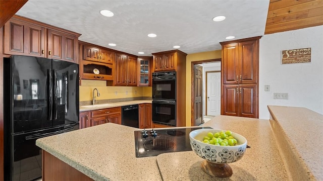 753 Bullcreek, City Of But Se, PA 16002 - kitchen featuring black appliances, recessed lighting, light countertops, and glass insert cabinets