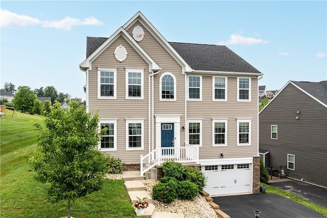 215 Saddle Ridge Dr, North Fayette, PA 15071 - view of front of house with an attached garage, driveway, and a front lawn
