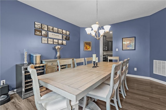 215 Saddle Ridge Dr, North Fayette, PA 15071 - dining area featuring dark wood-type flooring, a chandelier, and wine cooler
