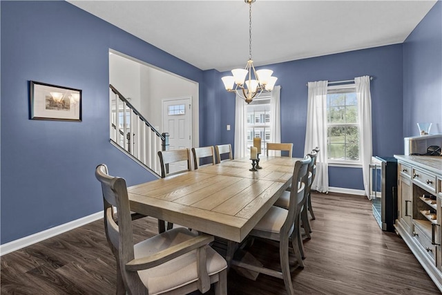 215 Saddle Ridge Dr, North Fayette, PA 15071 - dining room with a chandelier, stairway, and dark wood-style floors