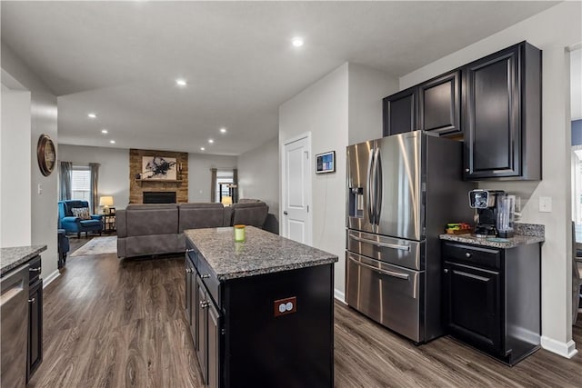 215 Saddle Ridge Dr, North Fayette, PA 15071 - kitchen with stainless steel refrigerator with ice dispenser, dark wood finished floors, a center island, recessed lighting, and stone counters